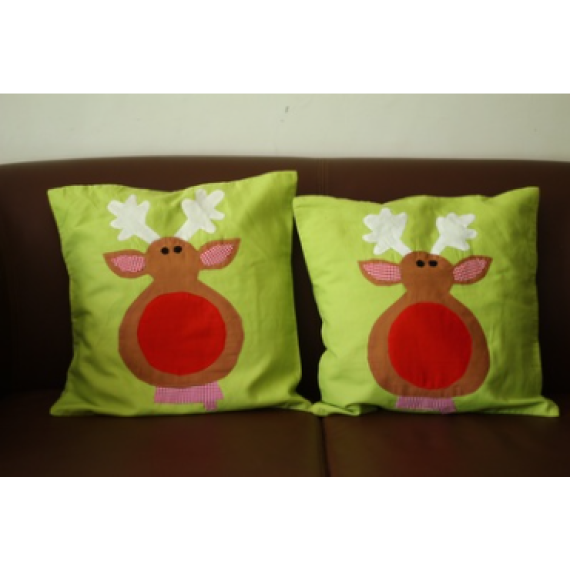 Green reindeer cushion covers